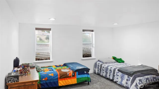 a bedroom with furniture and a window