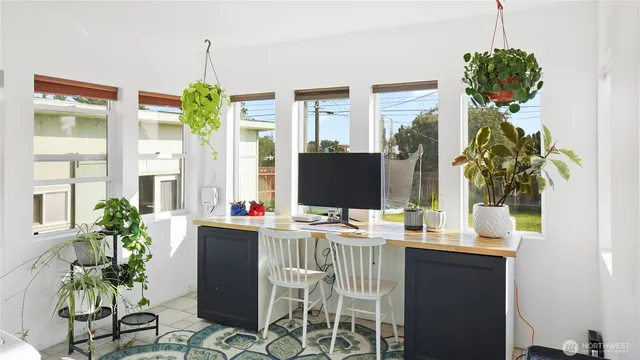 a workspace with furniture and window