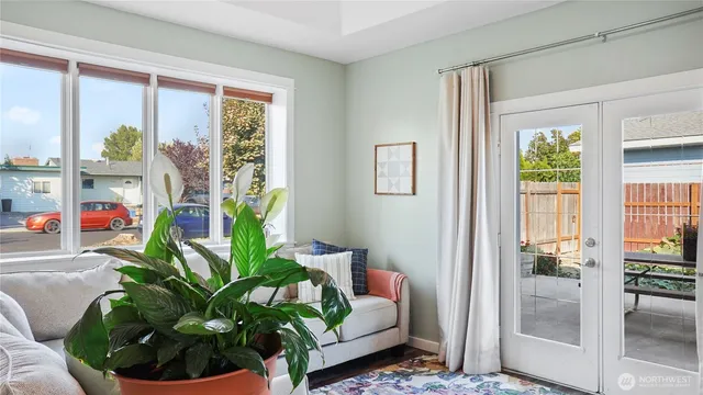 a dining room with furniture and a window