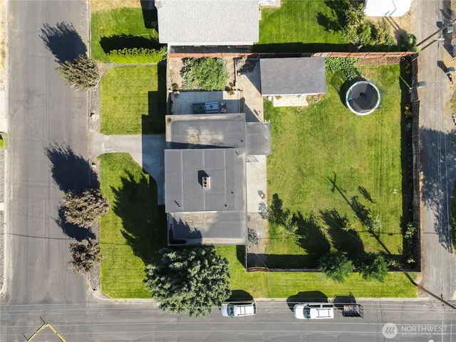 an aerial view of a house with a yard