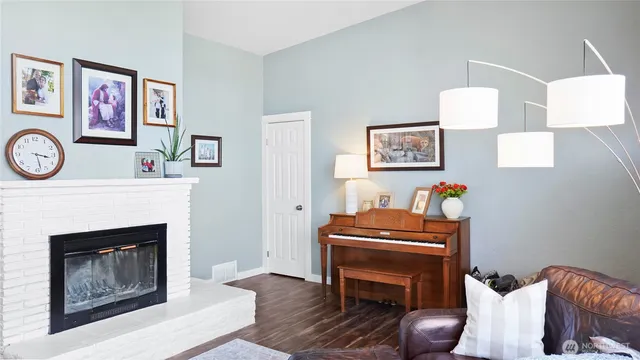 a room with furniture and a fireplace