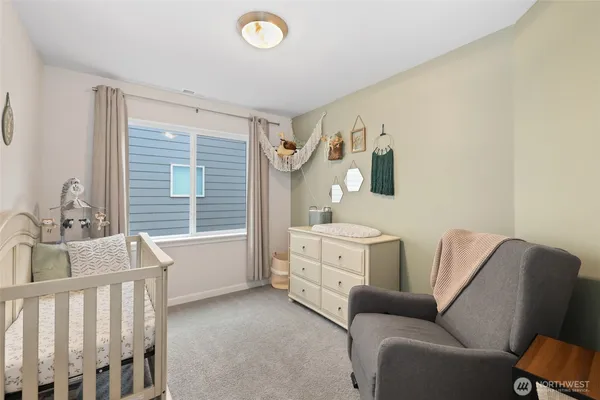 a bedroom with furniture and a window