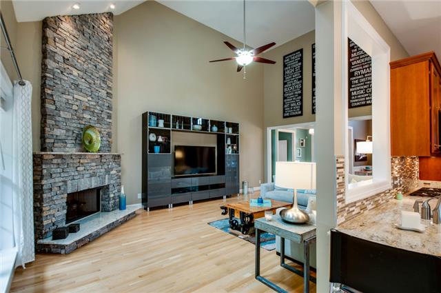 4844 Redcastle Ridge Nashville, TN 37211 - Photo 5 of 20 Spectacular limestone accented fireplace with granite hearth, mantle, and strategically placed lighting is the piece de resistance of the living room.