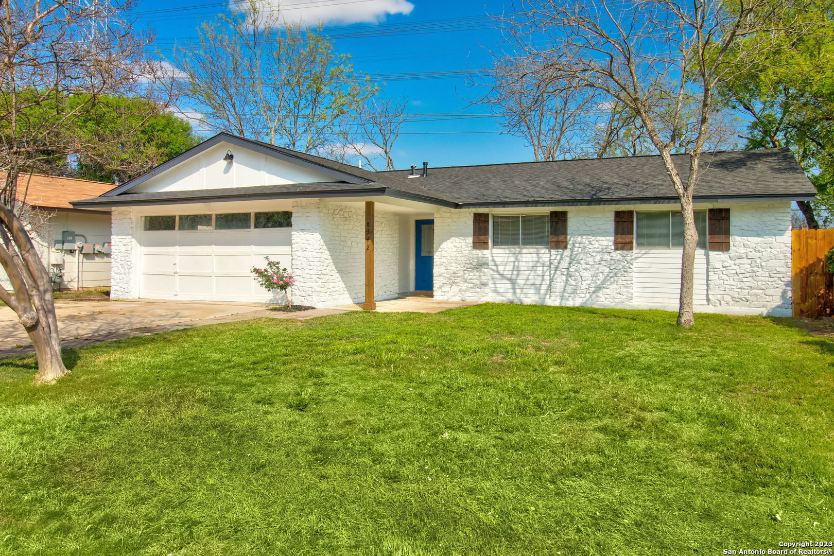 front view of a house with a yard