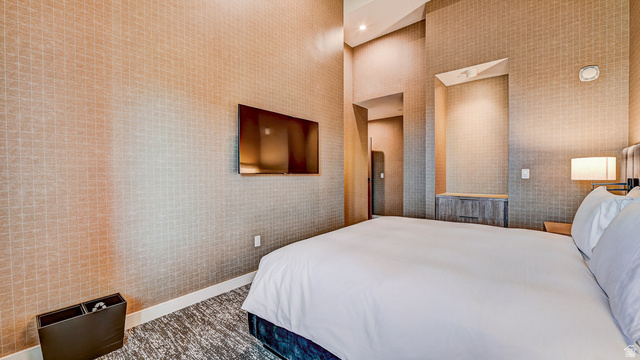 2417 West High Road, Unit 2515 Park City, UT 84098 - Photo 25 of 67 Bedroom featuring recessed lighting and wallpapered walls