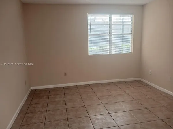 an empty room with a empty space and window