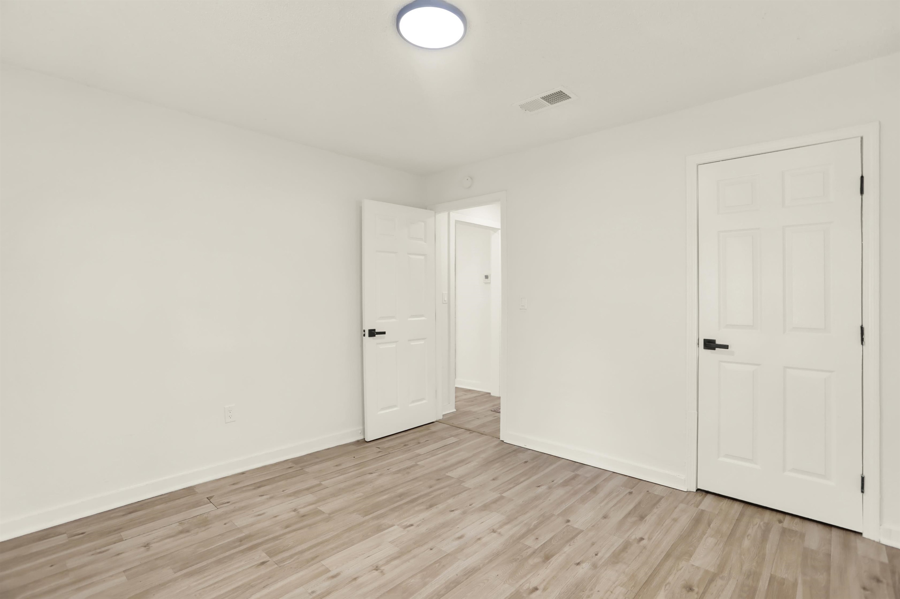 3393 Berea Road Memphis, TN 38109 - Photo 16 of 20 a view of an empty room and wooden floor