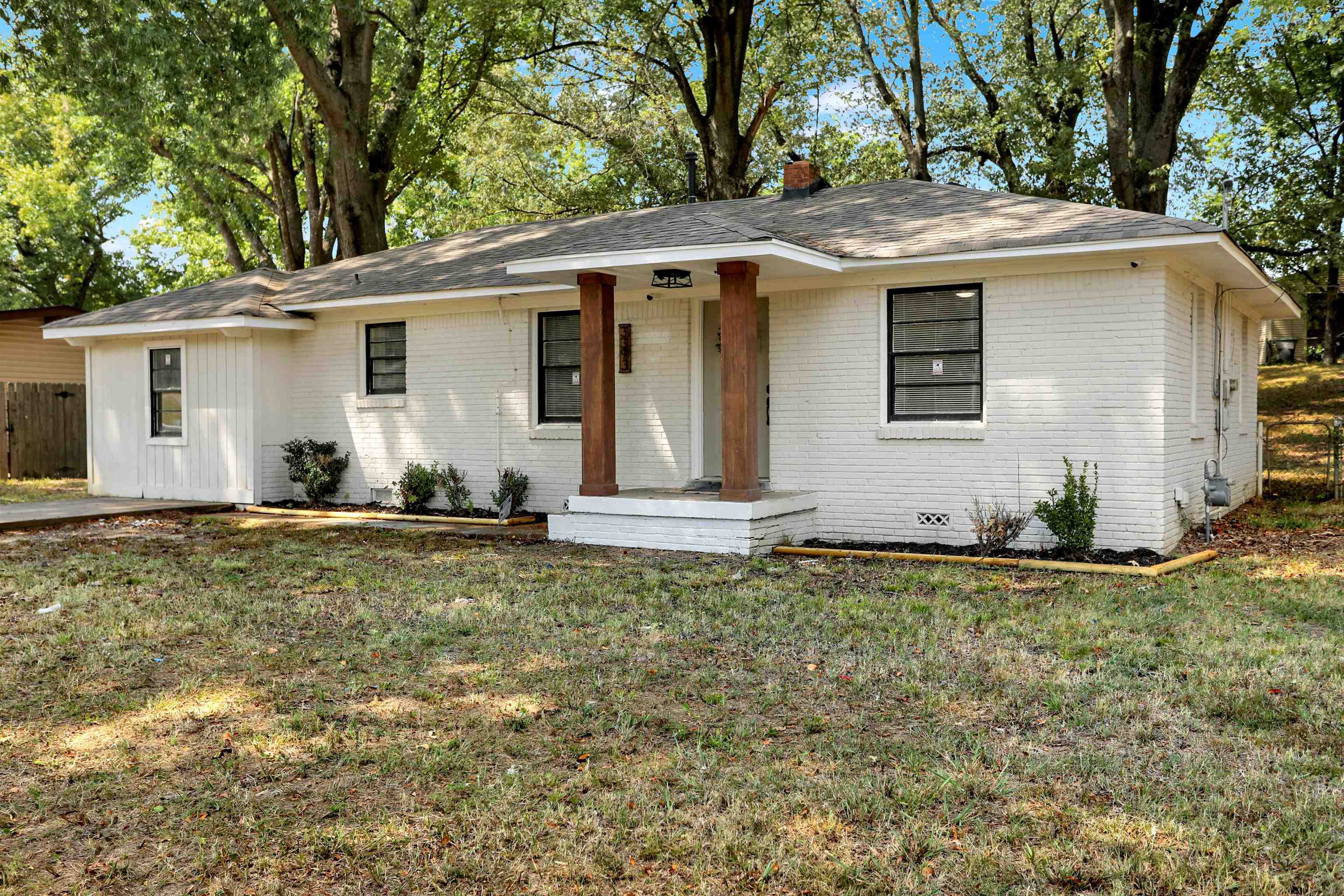 3393 Berea Road Memphis, TN 38109 - Photo 2 of 20 a backyard of a house with yard and outdoor seating