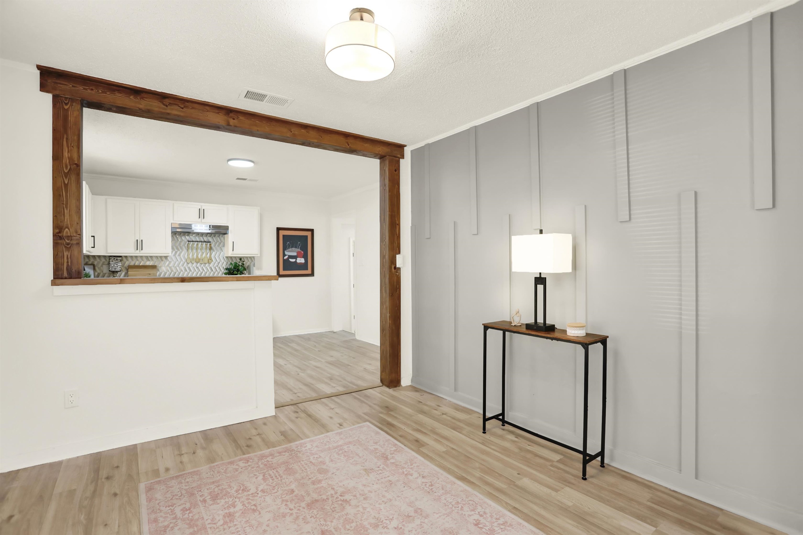 3393 Berea Road Memphis, TN 38109 - Photo 7 of 20 a view of a room with wooden floor and cabinet