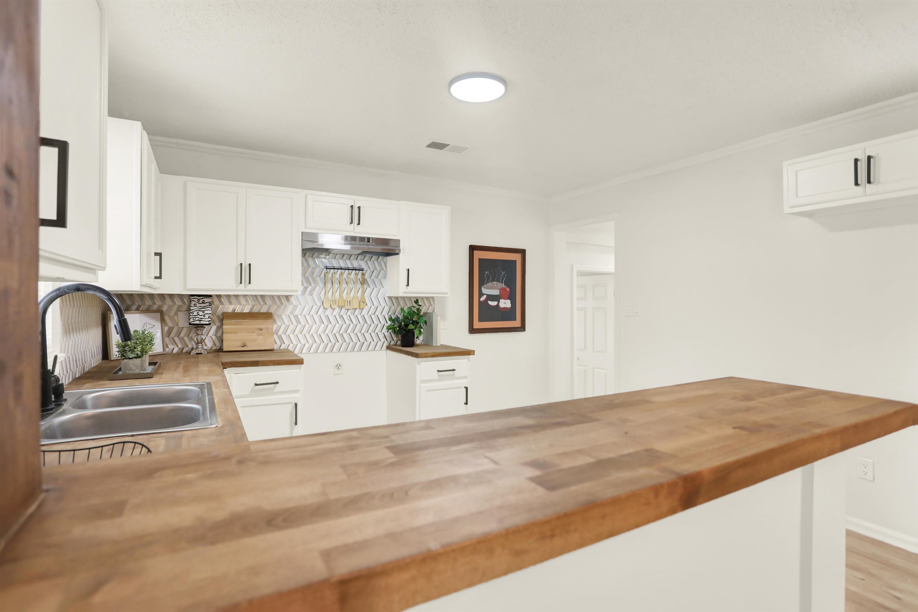 3393 Berea Road Memphis, TN 38109 - Photo 9 of 20 a kitchen with stainless steel appliances granite countertop a sink and cabinets