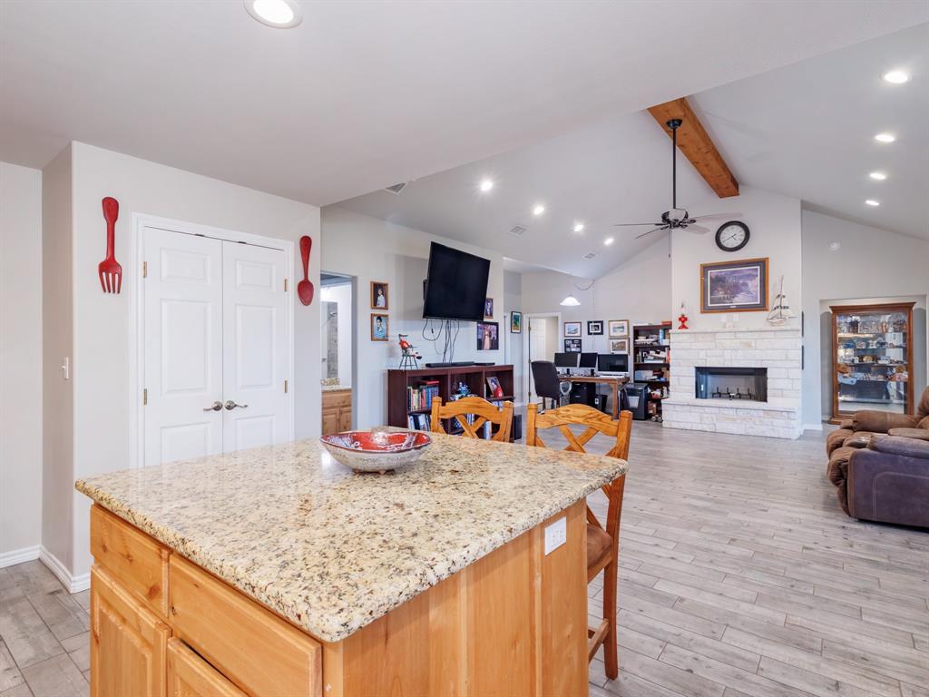 202 East Hall Court Early, TX 76802 - Photo 11 of 34 a living room with furniture and a fireplace