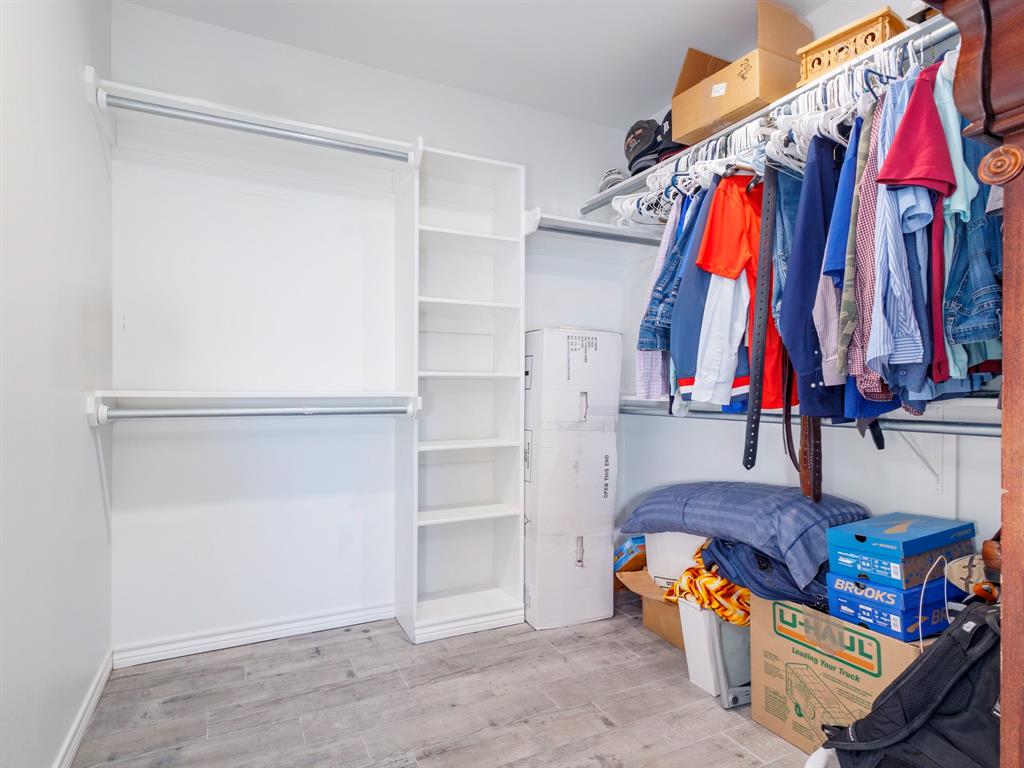 202 East Hall Court Early, TX 76802 - Photo 17 of 34 a view of walk in closet with clothes and shoes