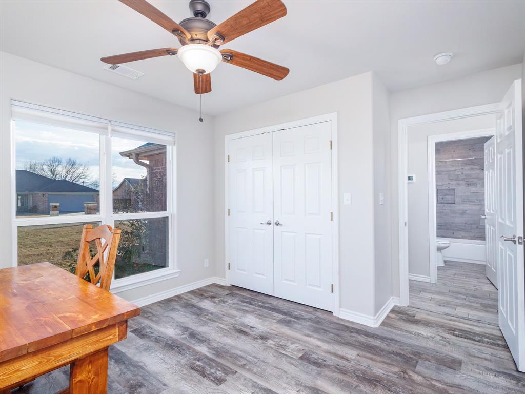 202 East Hall Court Early, TX 76802 - Photo 19 of 34 a view of a livingroom with furniture window and wooden floor