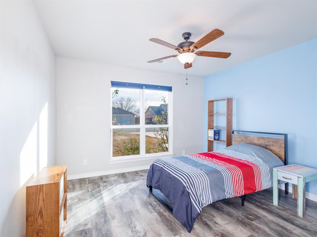 202 East Hall Court Early, TX 76802 - Photo 20 of 34 a bedroom with a large bed and a window