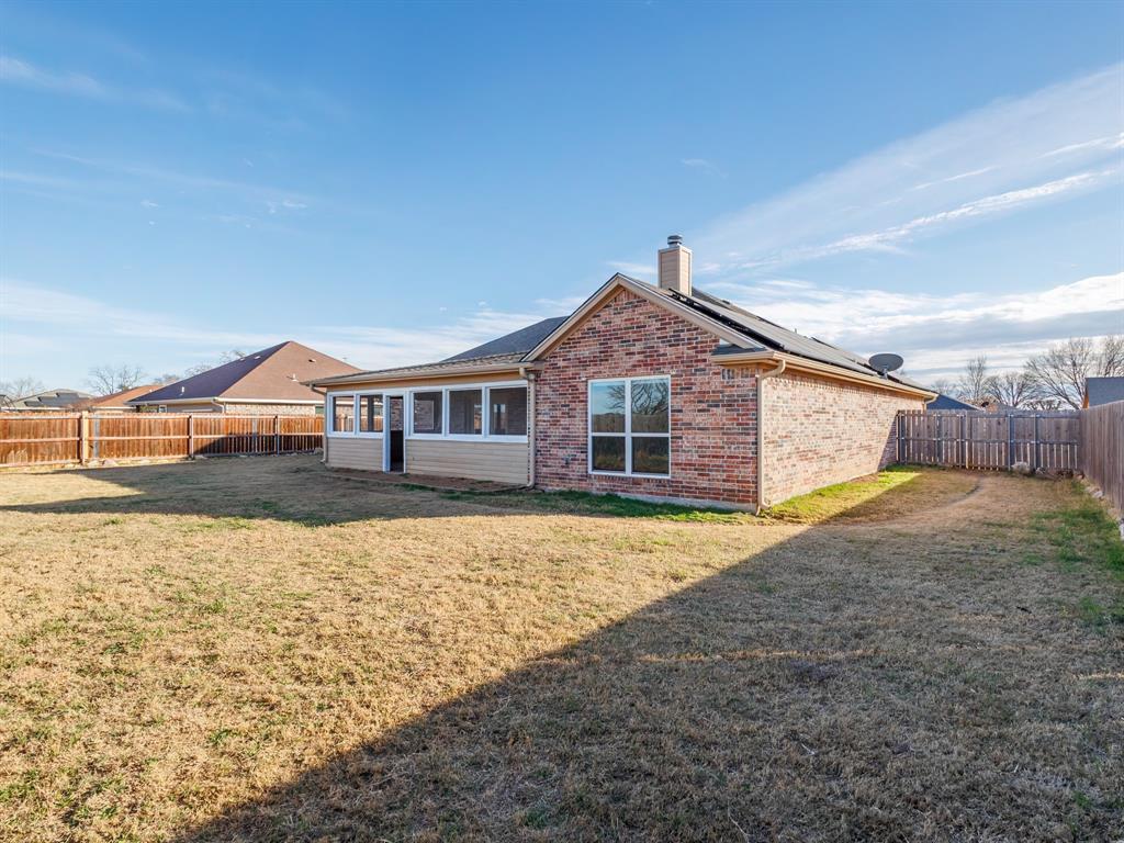 202 East Hall Court Early, TX 76802 - Photo 26 of 34 a front view of a house with a yard
