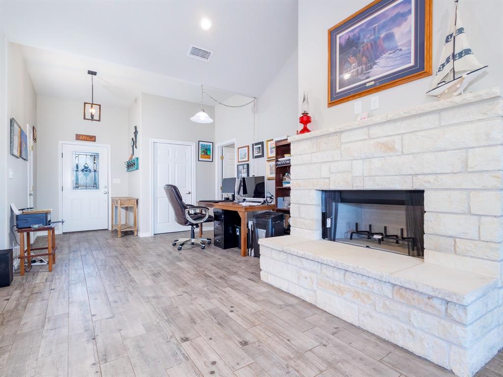 202 East Hall Court Early, TX 76802 - Photo 6 of 34 a living room with furniture and a fireplace