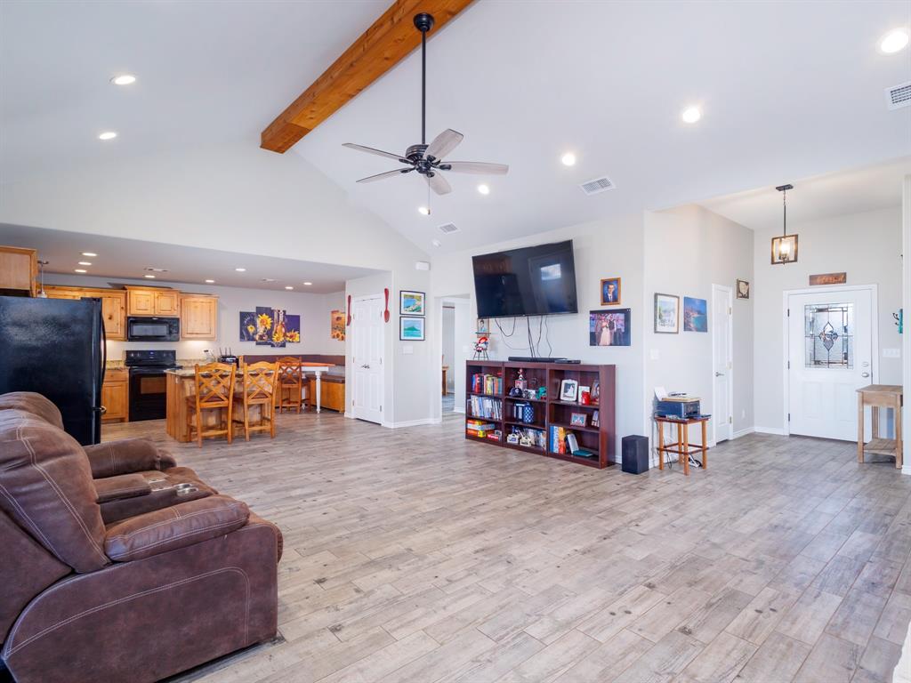 202 East Hall Court Early, TX 76802 - Photo 7 of 34 a view of a livingroom with furniture and a flat screen tv