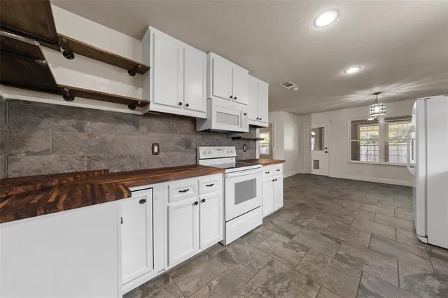 a large kitchen with cabinets