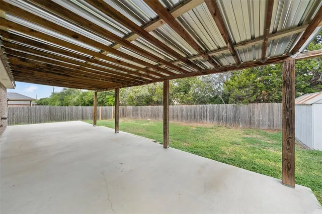 a view of backyard with green space