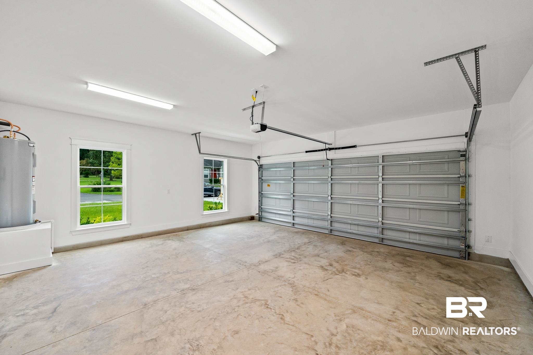 29 Signal Hill Road Daphne, AL 36527 - Photo 28 of 36 Garage featuring a garage door opener and water heater