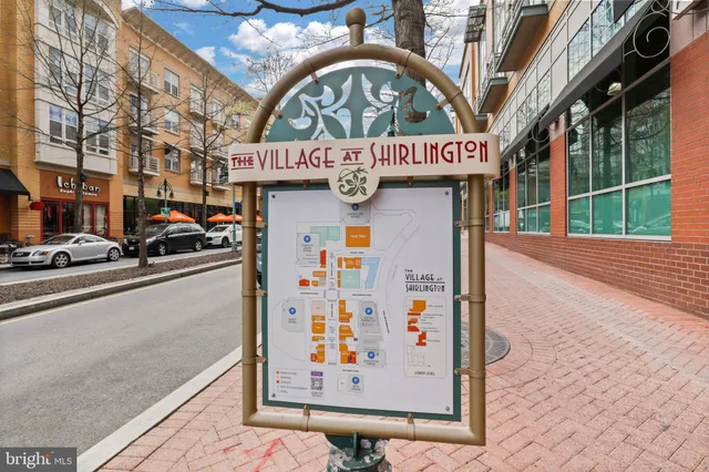 a view of a street with an entrance and a potted plant