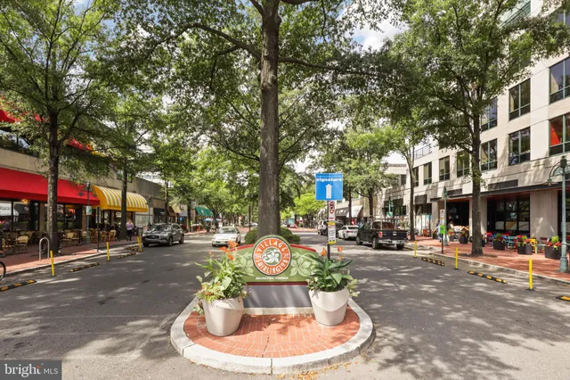a swimming pool with outdoor seating and a patio