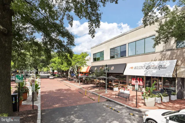 an outdoor space with lots of outdoor seating