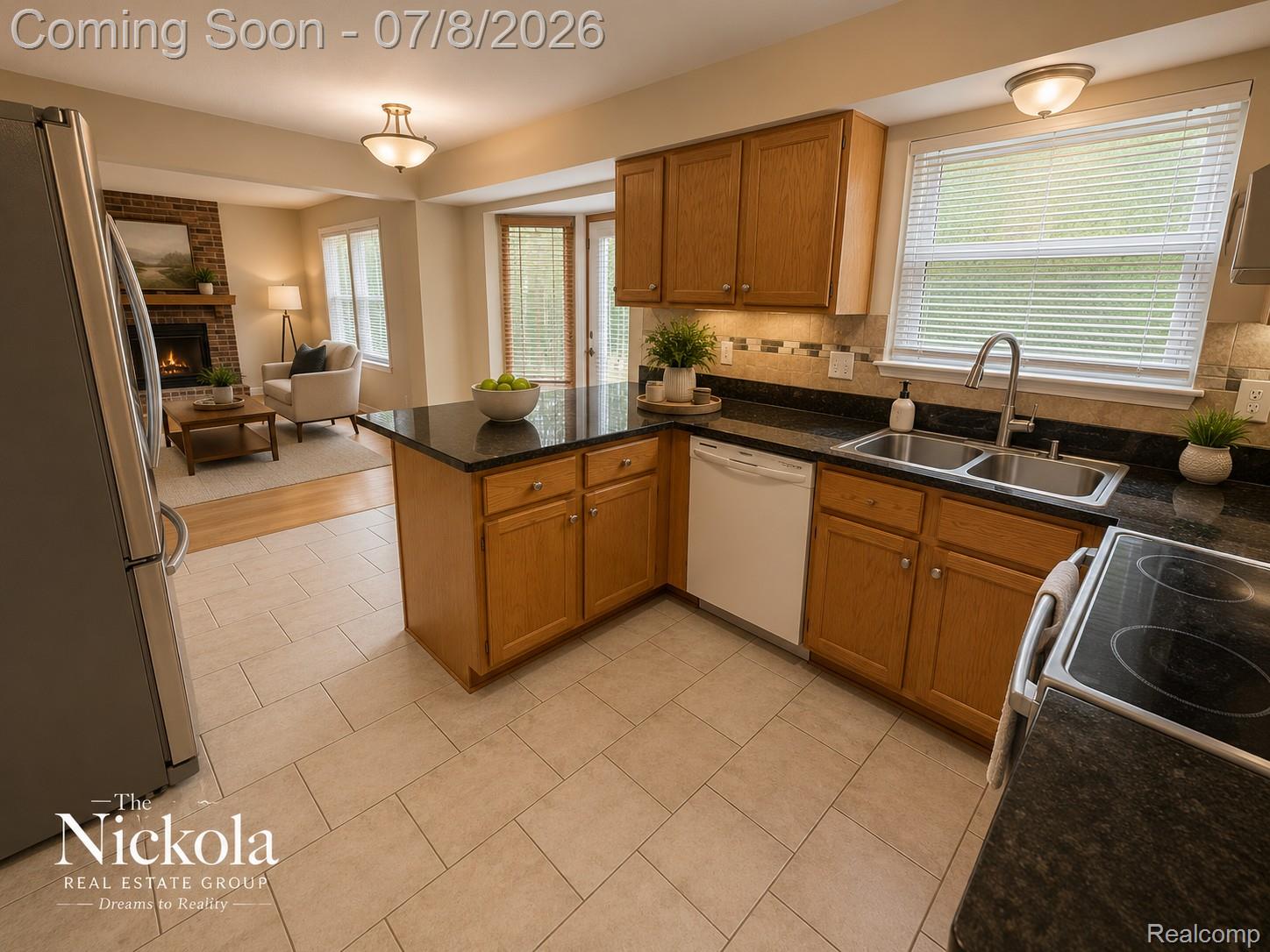 414 Whitney Drive Rochester, MI 48307 - Photo 13 of 30 Kitchen featuring wood cabinetry, dark granite countertops, stainless steel sink with gooseneck faucet, and tile backsplash
