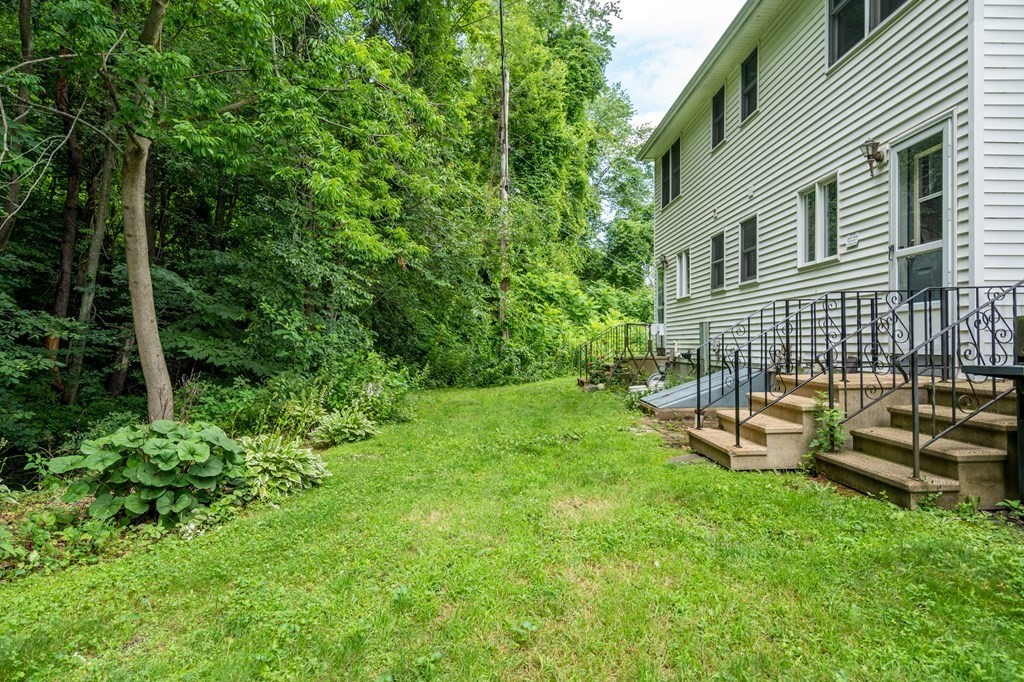 720 Russell Road, Unit C Westfield, MA 01085 - Photo 3 of 26 a view of a house with backyard