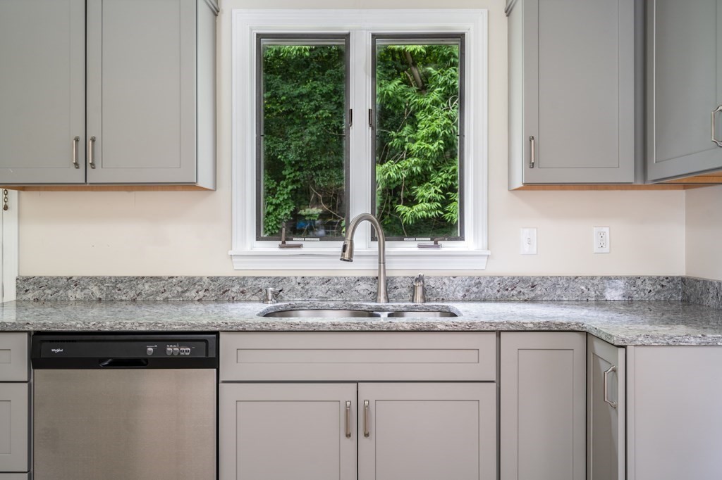 720 Russell Road, Unit C Westfield, MA 01085 - Photo 9 of 26 a kitchen with granite countertop white cabinets and a sink