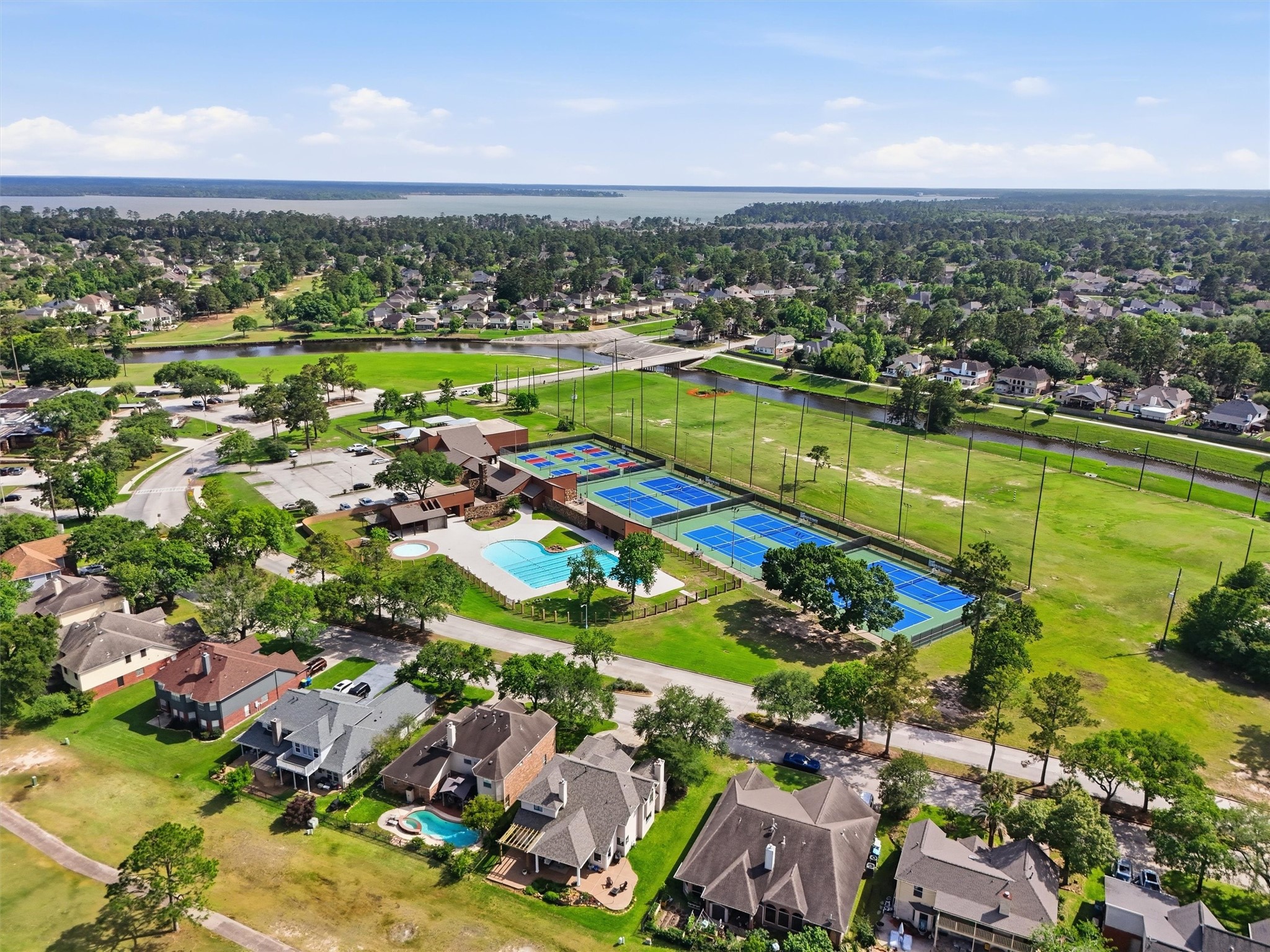 8827 Mile Run Road Humble, TX 77346 - Photo 34 of 37 an aerial view of residential houses with outdoor space