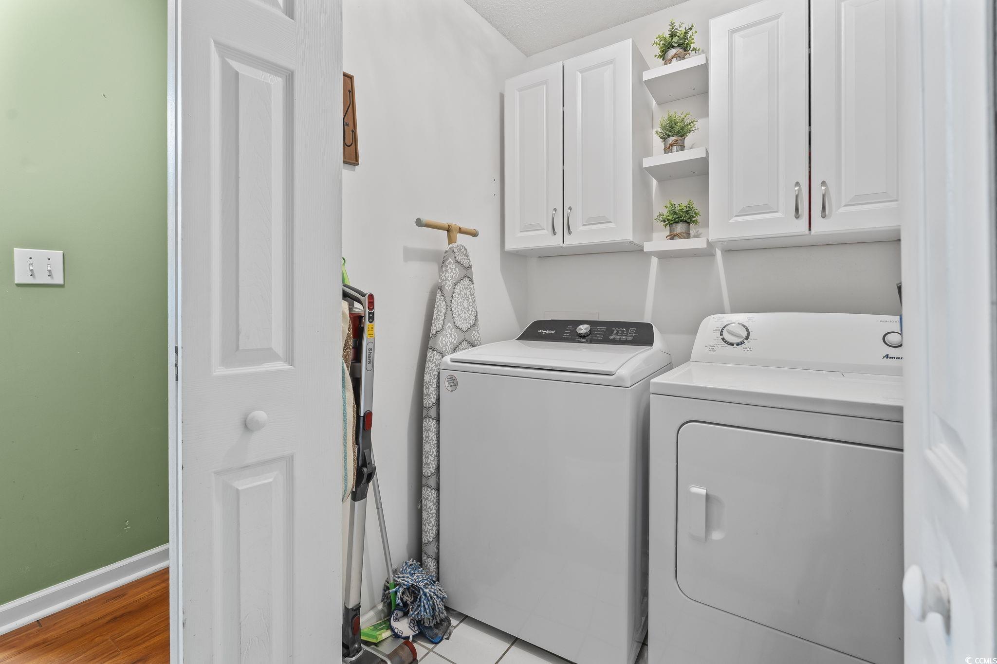 154 Hummingbird Court Myrtle Beach, SC 29579 - Photo 15 of 38 Washroom featuring independent washer and dryer, cabinet space, and wood finished floors