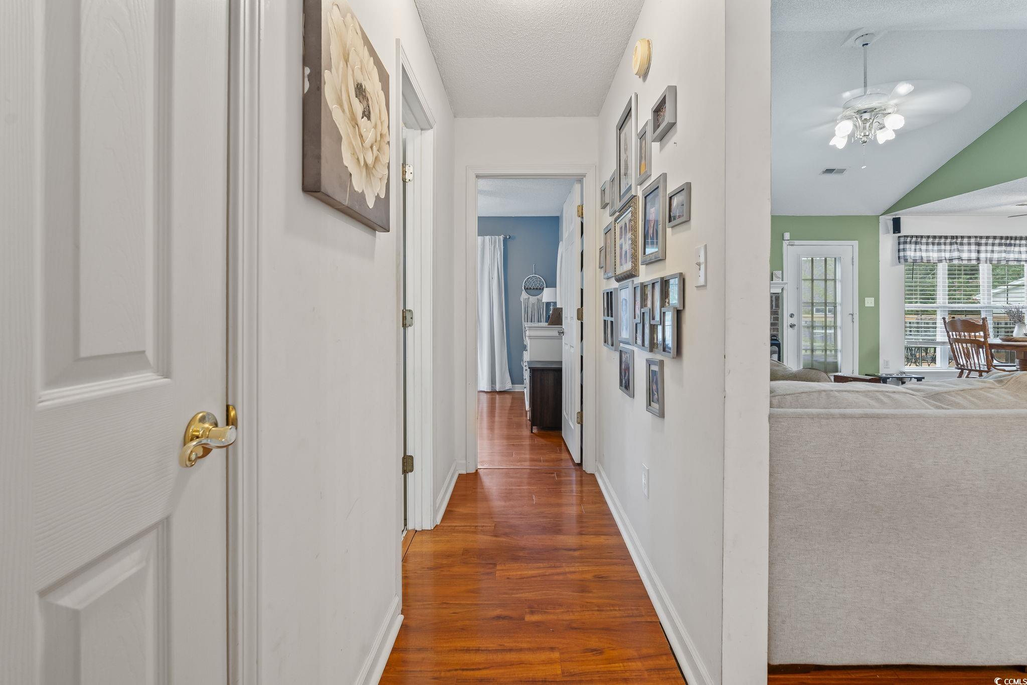 154 Hummingbird Court Myrtle Beach, SC 29579 - Photo 28 of 38 Hall featuring baseboards and dark wood-style flooring