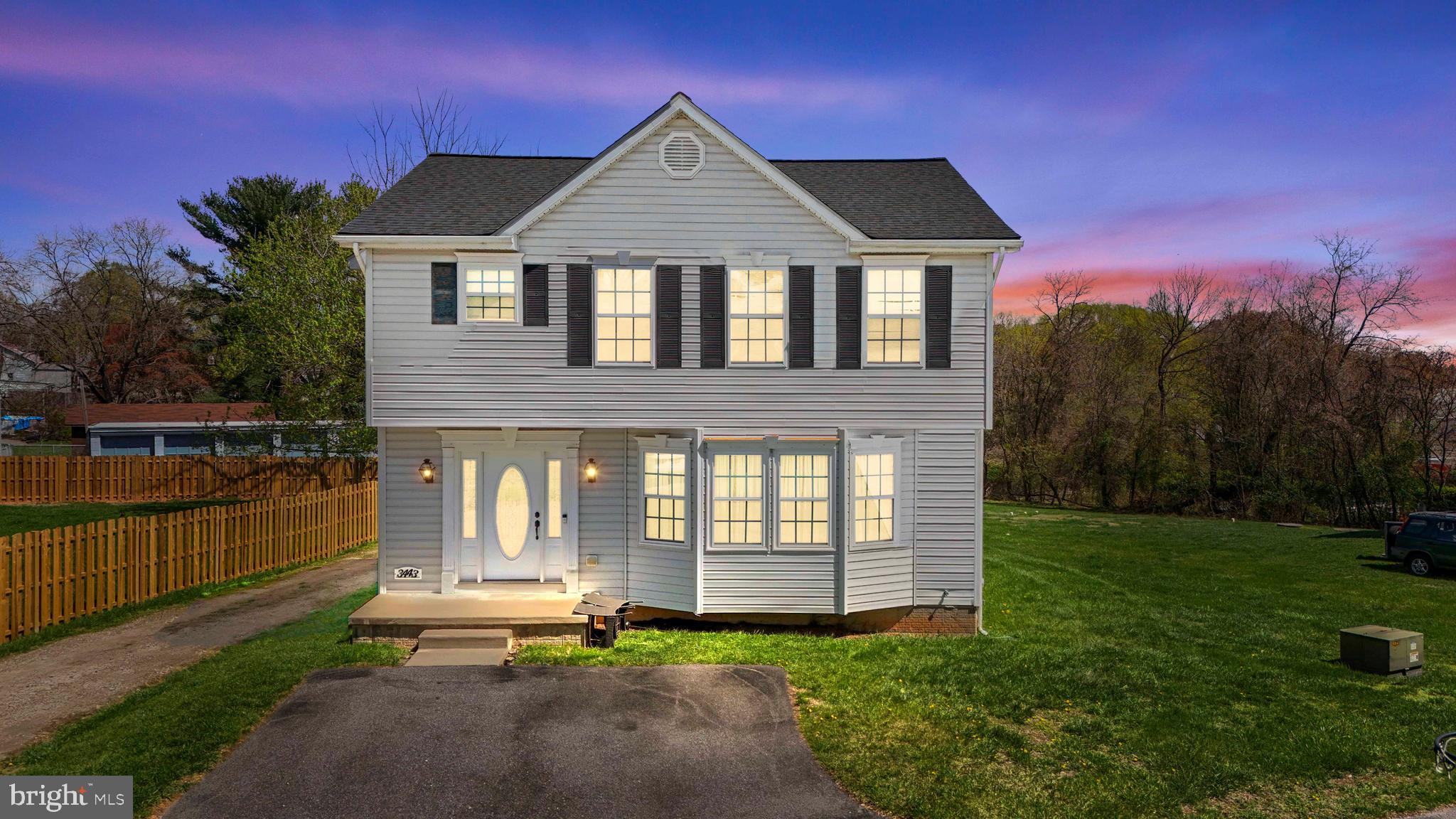 3443 Chapman Road Randallstown, MD 21133 - Photo 1 of 56 a front view of a house with a yard