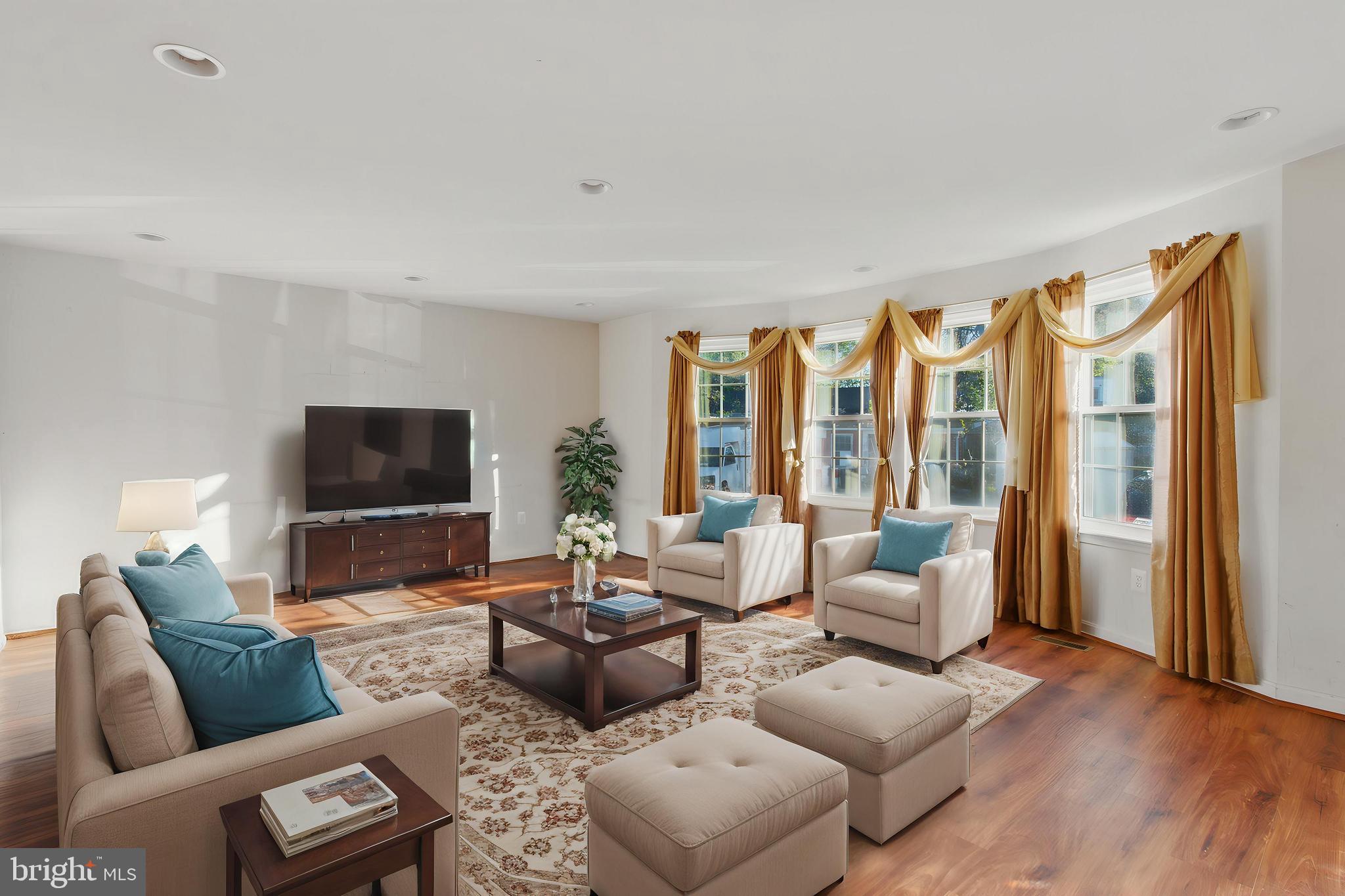 3443 Chapman Road Randallstown, MD 21133 - Photo 26 of 56 a living room with furniture and a flat screen tv
