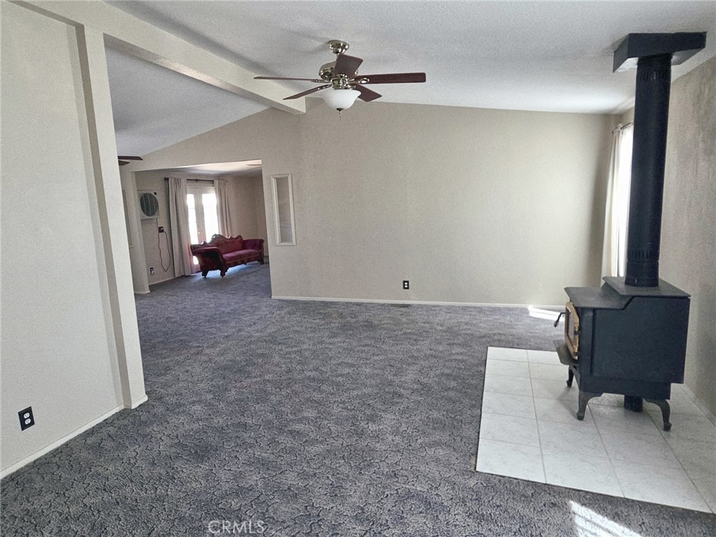 49645 3 Points Road Lancaster, CA 93536 - Photo 12 of 40 an empty room with fan and windows