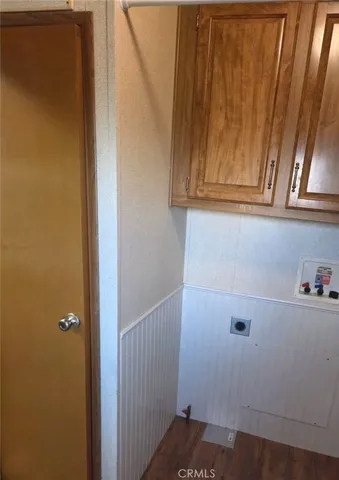 a view of storage and utility room with cabinets