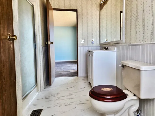 a bathroom with a sink a toilet and a bathtub