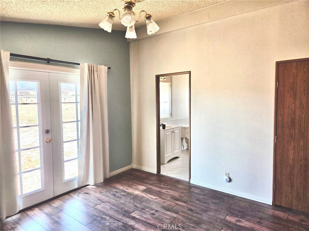 49645 3 Points Road Lancaster, CA 93536 - Photo 27 of 40 a view of a livingroom with a chandelier fan and windows