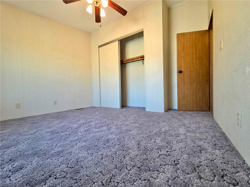 49645 3 Points Road Lancaster, CA 93536 - Photo 32 of 40 a view of a big room with a chandelier fan