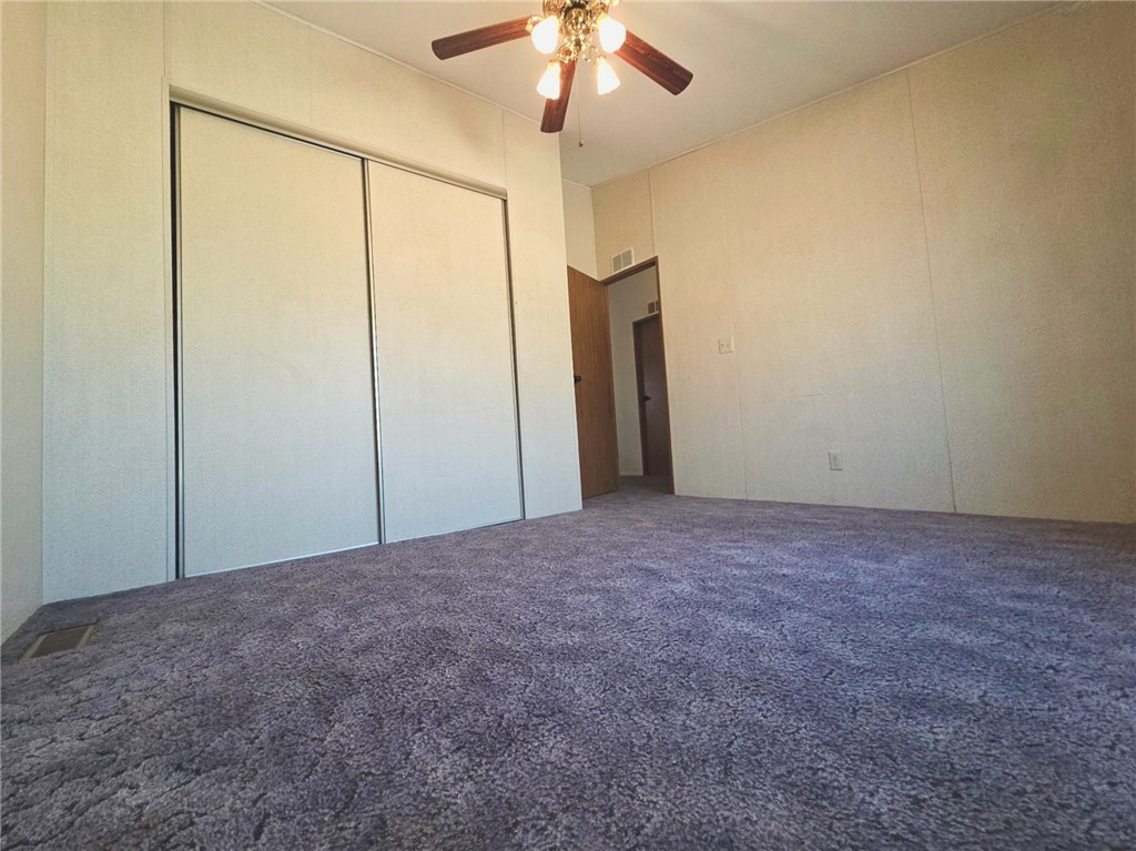 49645 3 Points Road Lancaster, CA 93536 - Photo 35 of 40 a view of an empty room with a chandelier fan