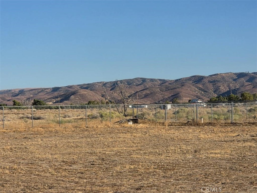 49645 3 Points Road Lancaster, CA 93536 - Photo 39 of 40 a view of a lake with mountains in the background
