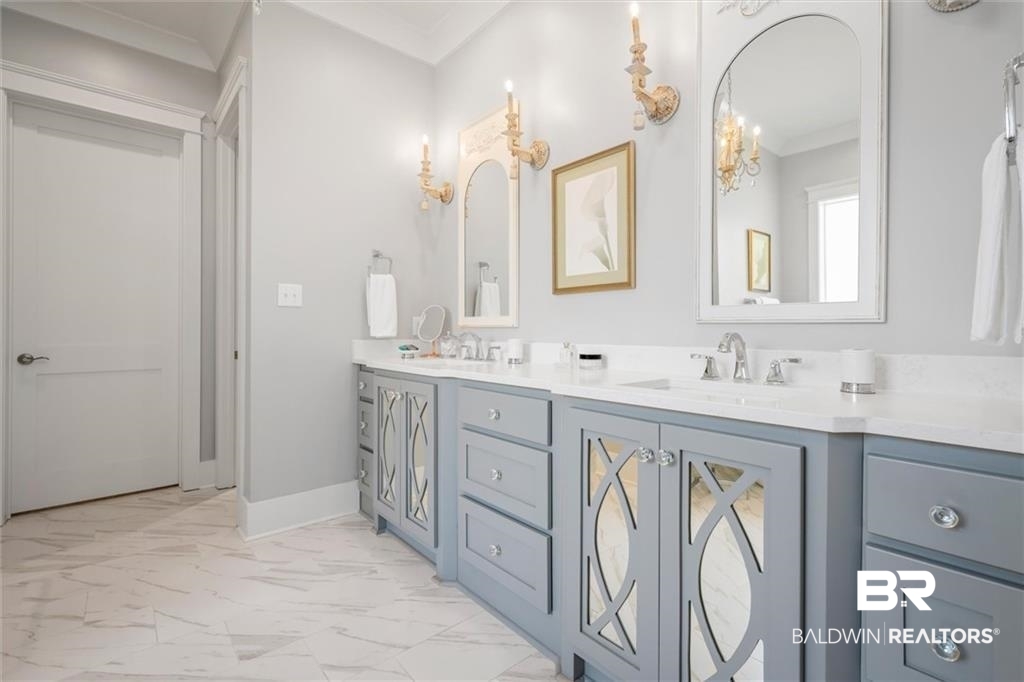 707 Cardamel Court Fairhope, AL 36532 - Photo 19 of 40 Bathroom featuring tile patterned flooring, double sink vanity, and crown molding