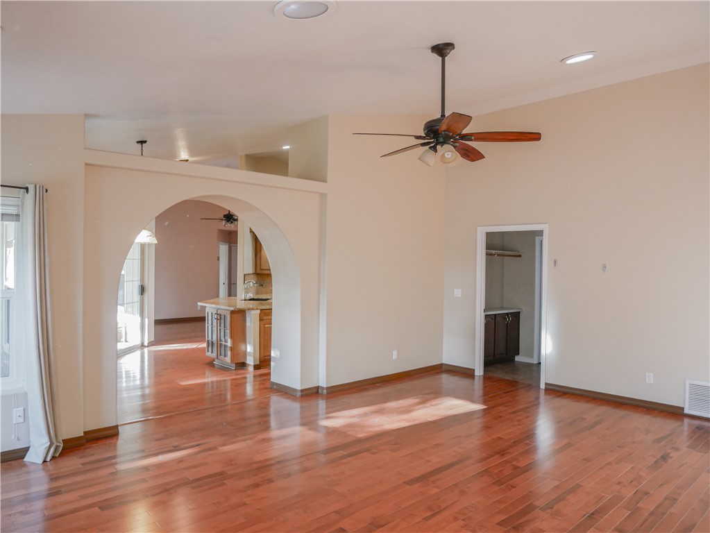 2575 Triangle S Street Kingman, AZ 86401 - Photo 15 of 45 wooden floor in an empty room with a window