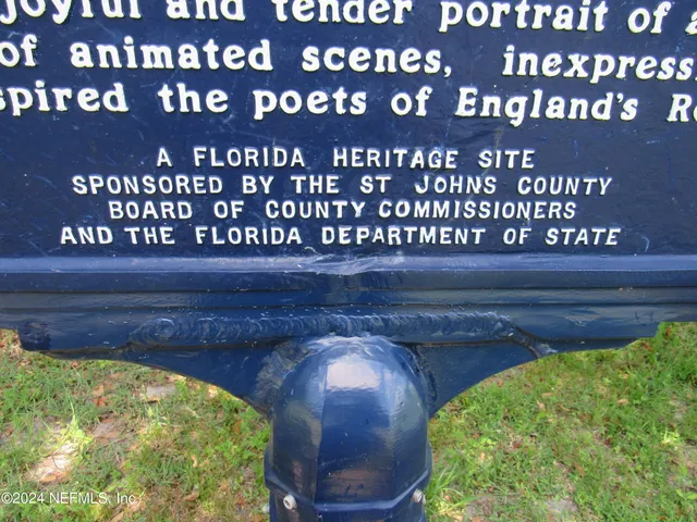 a wooden bench sitting in front of a building