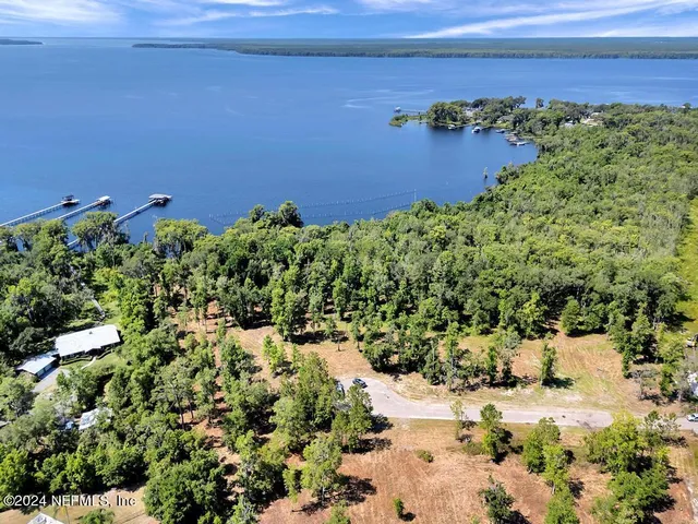 a view of a lake with a yard