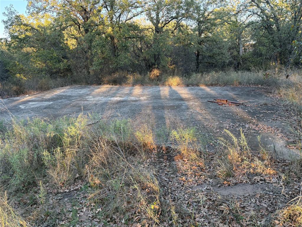 410 Wild Hill Springtown, TX 76082 - Photo 18 of 19 a view of back yard of a house