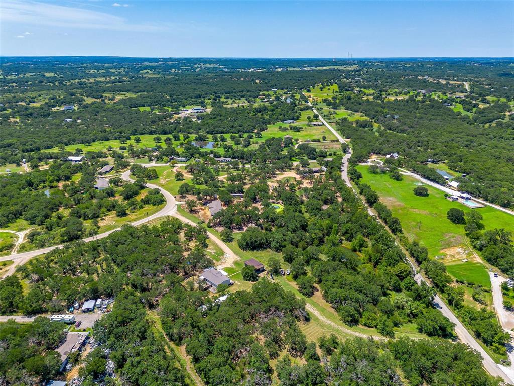 410 Wild Hill Springtown, TX 76082 - Photo 8 of 19 an aerial view of residential houses with outdoor space and trees