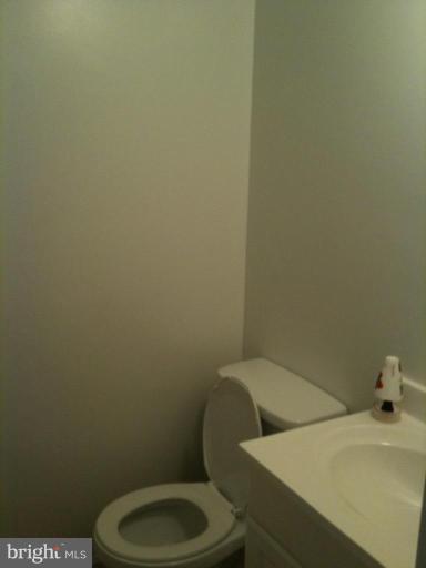7922 Spring Forest Court, Unit 4A Springfield, VA 22152 - Photo 5 of 12 a bathroom with a toilet and a sink
