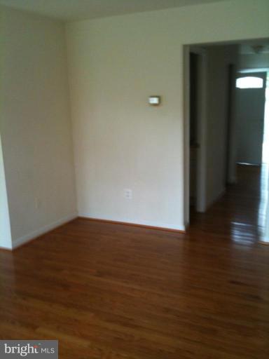 7922 Spring Forest Court, Unit 4A Springfield, VA 22152 - Photo 6 of 12 a view of an empty room and wooden floor